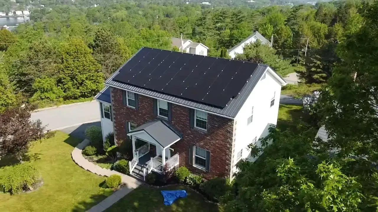Aerial photo of a home with a solar system installed on the roof